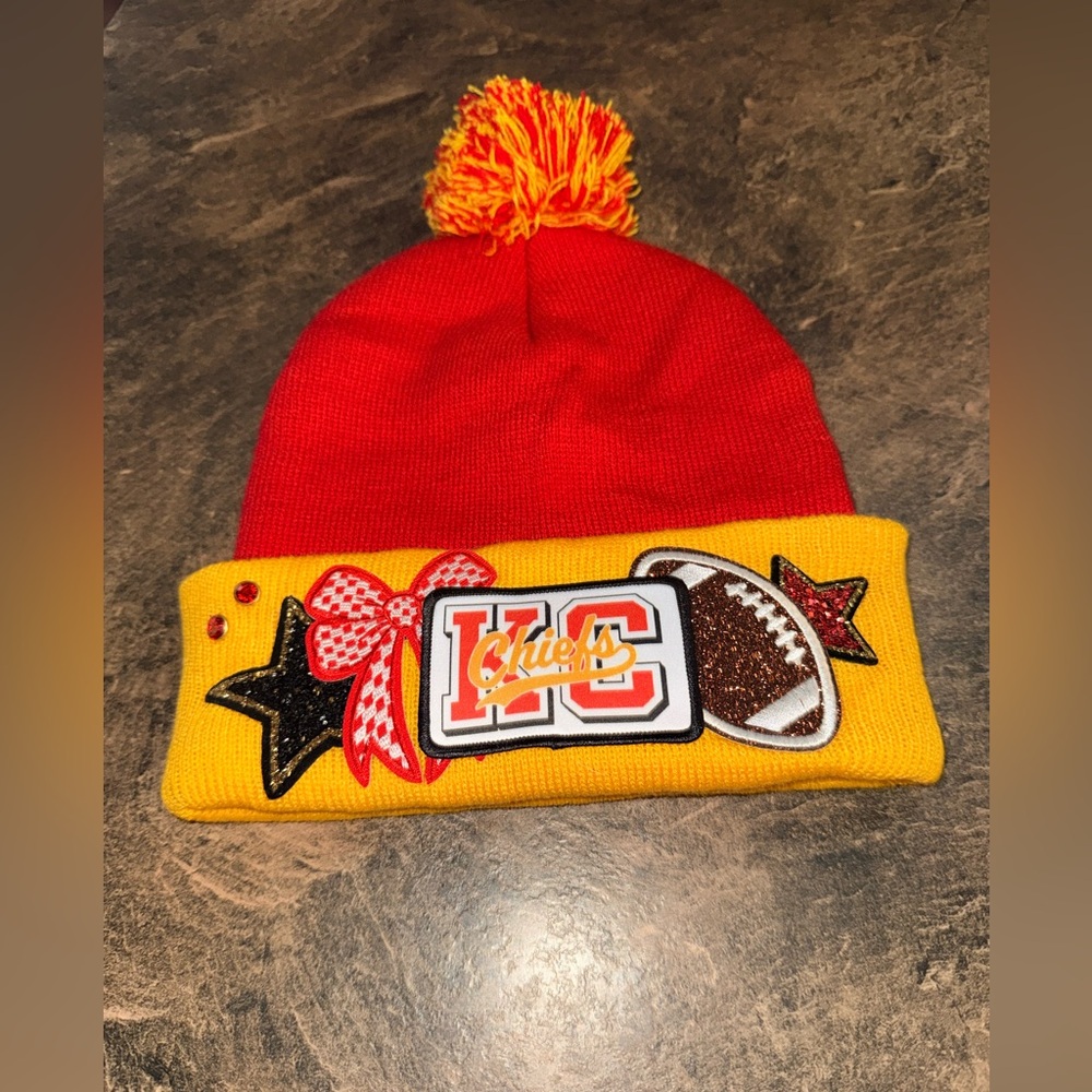 Brand new. Kansas City Chiefs Red and Yellow Knit Beanie with Football Patch